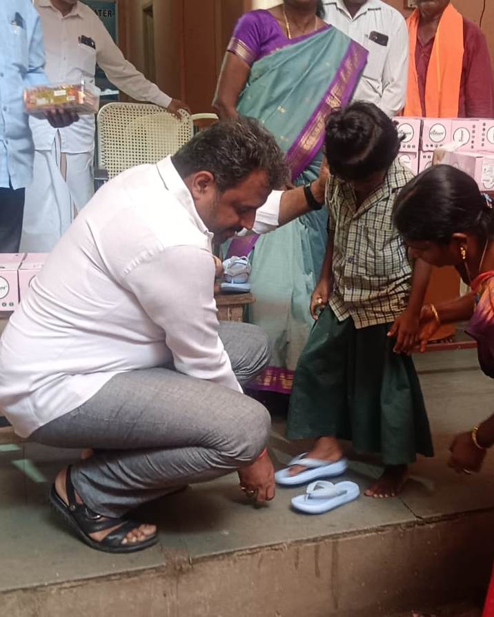 Providing footwear to all the girl children at Annai Sathiya District Govt Home