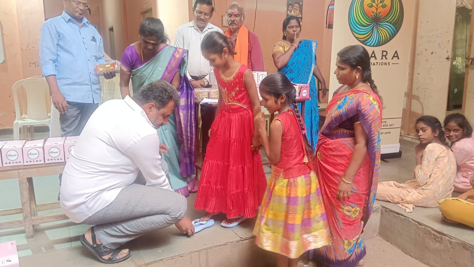 Providing footwear to all the girl children at Annai Sathiya District Govt Home